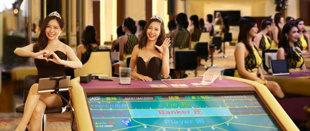 Two female croupier from Asian Gaming dealing Bid Baccarat